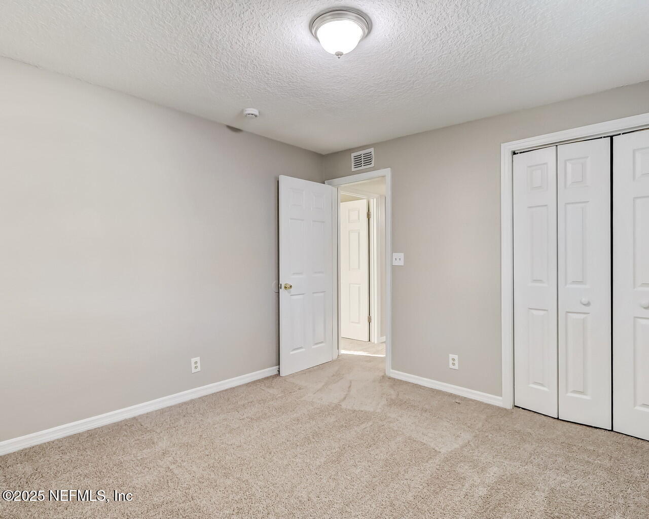 2028 Hartridge Street Jacksonville, FL 32209 - Photo 30 of 33 an empty room with closet area