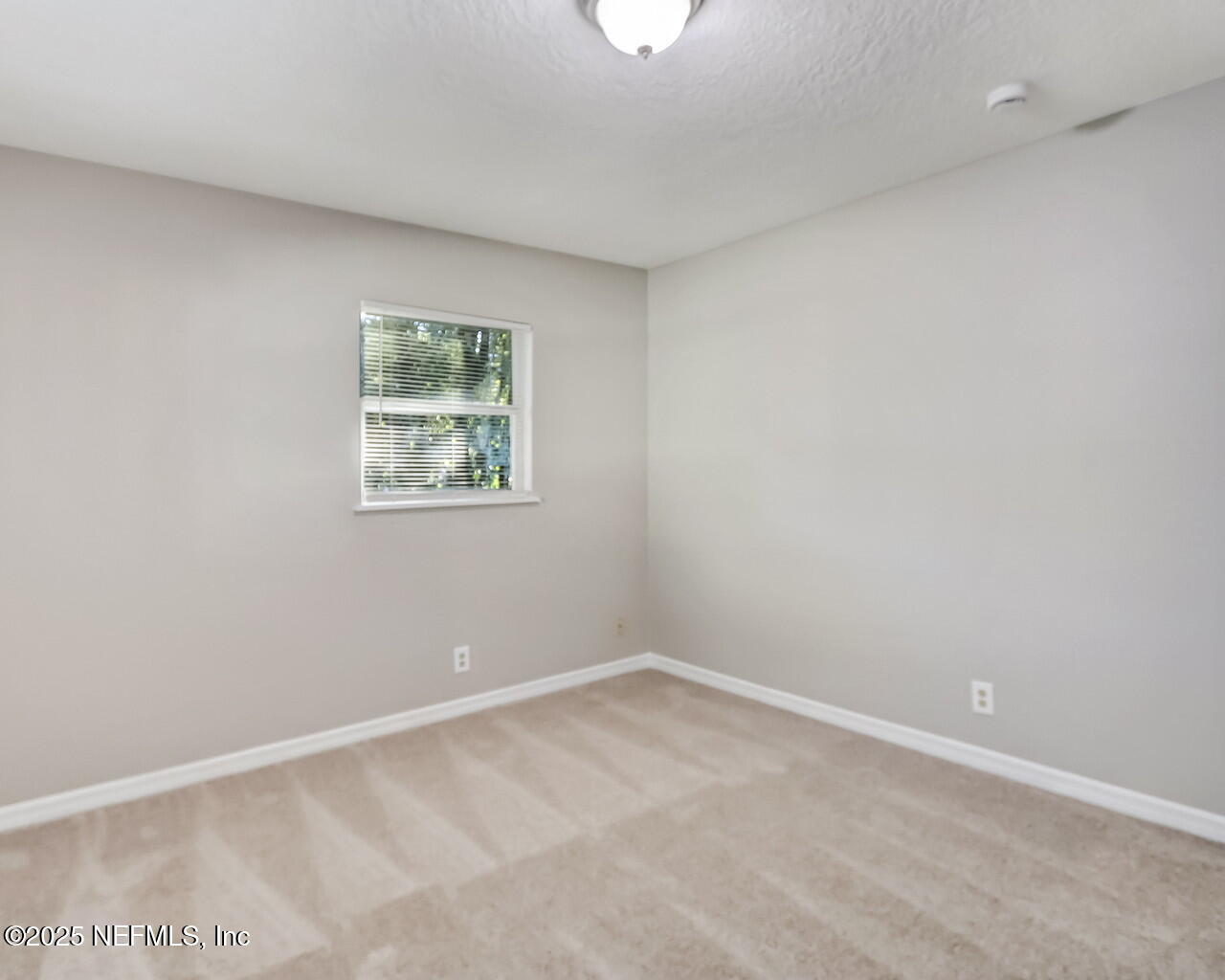 2028 Hartridge Street Jacksonville, FL 32209 - Photo 31 of 33 an empty room with a window