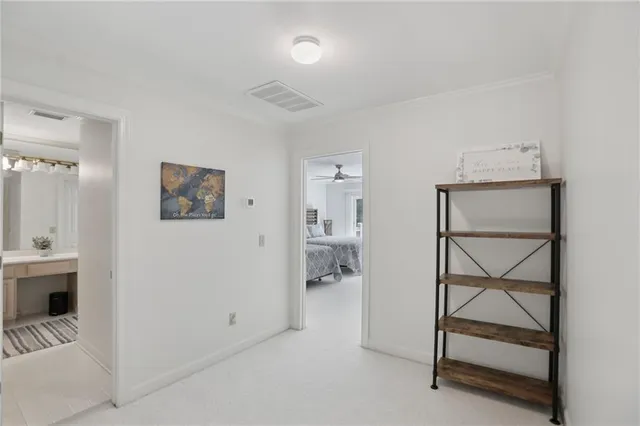 a dining room with furniture a chandelier and window