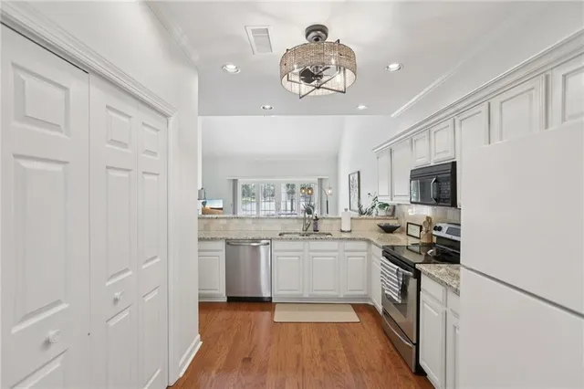 a couple of potted plants in front of door