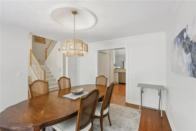 a view of dirt field with trees in the background