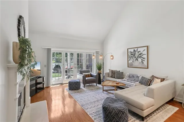 a view of a house with pool and chairs