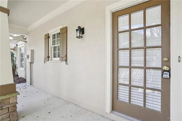 a view of a house with pool and chairs