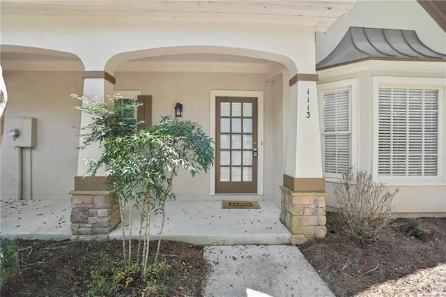 a view of a house with a garden and pathway
