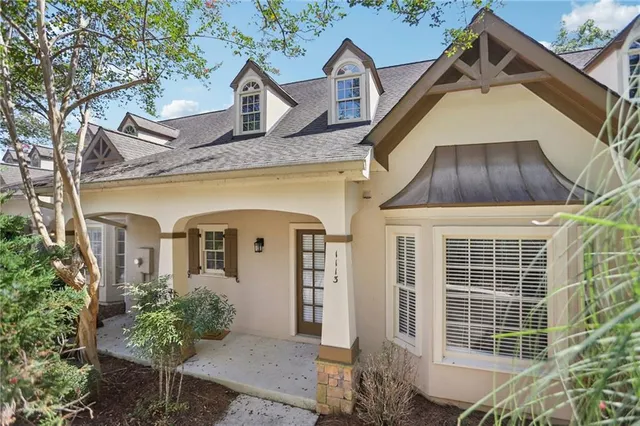 a front view of a house with a yard and porch