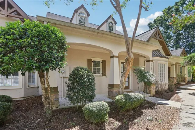 a view of house with yard and green space