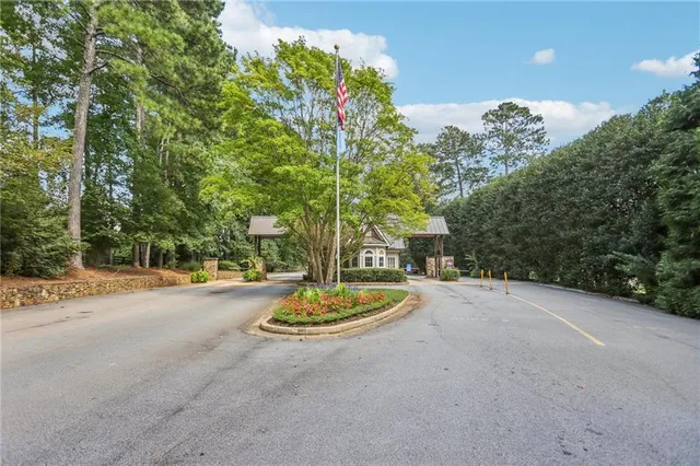a bedroom with furniture and a large window