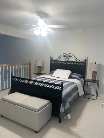 a bedroom with a bed and a tv on table