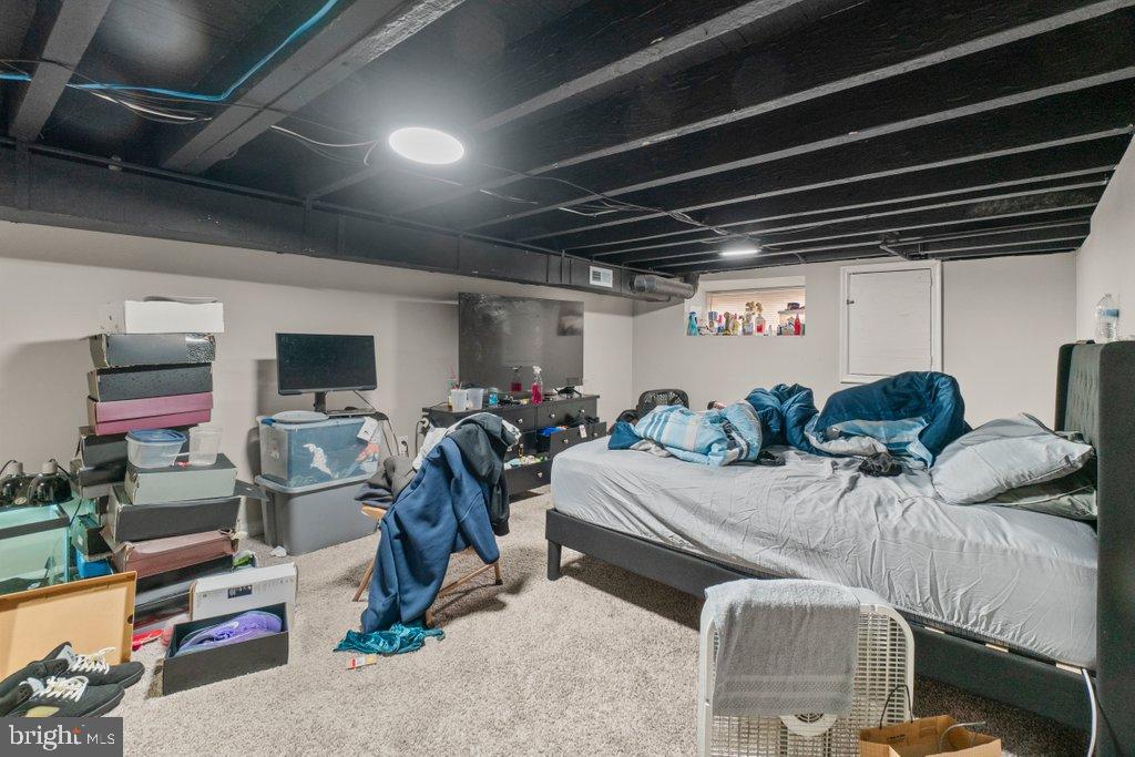 2436 East Preston Street Baltimore, MD 21213 - Photo 13 of 22 a room with gym equipment and a mirror