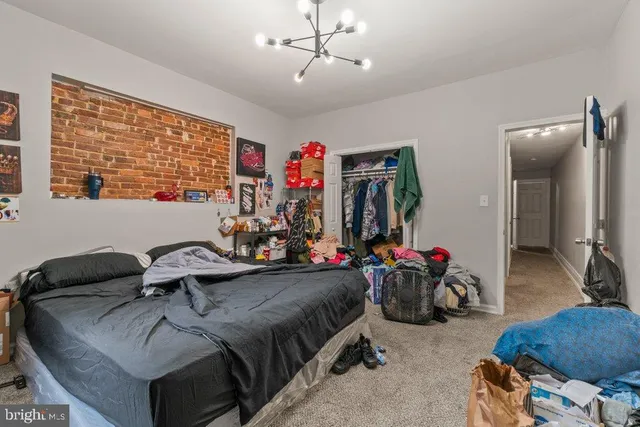 a bedroom with bed and a window