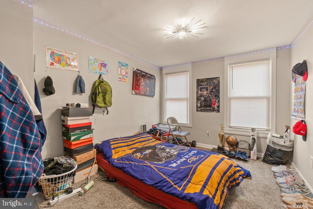 2436 East Preston Street Baltimore, MD 21213 - Photo 18 of 22 a living room with furniture and paintings on the wall