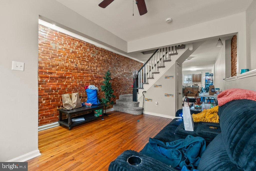 2436 East Preston Street Baltimore, MD 21213 - Photo 5 of 22 a living room with furniture and a flat screen tv