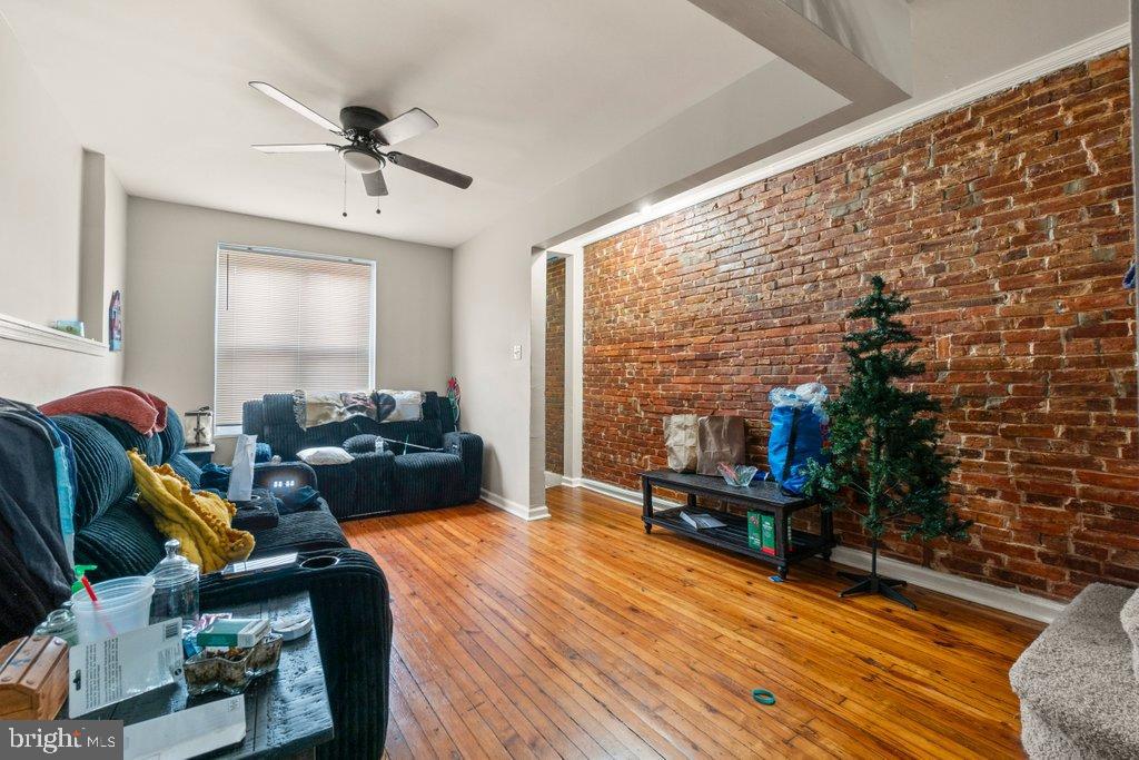 2436 East Preston Street Baltimore, MD 21213 - Photo 6 of 22 a living room with furniture and a floor to ceiling window