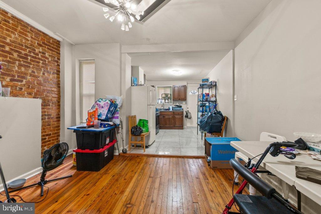 2436 East Preston Street Baltimore, MD 21213 - Photo 8 of 22 a living room with furniture and a wooden floor