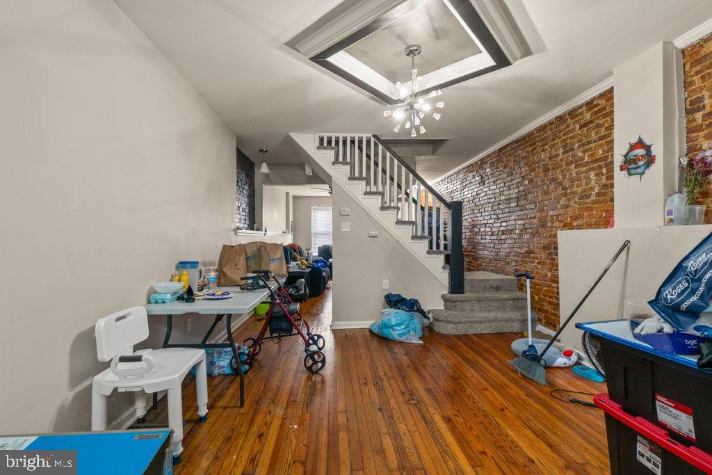 2436 East Preston Street Baltimore, MD 21213 - Photo 10 of 22 a workspace with furniture entryway and wooden floor