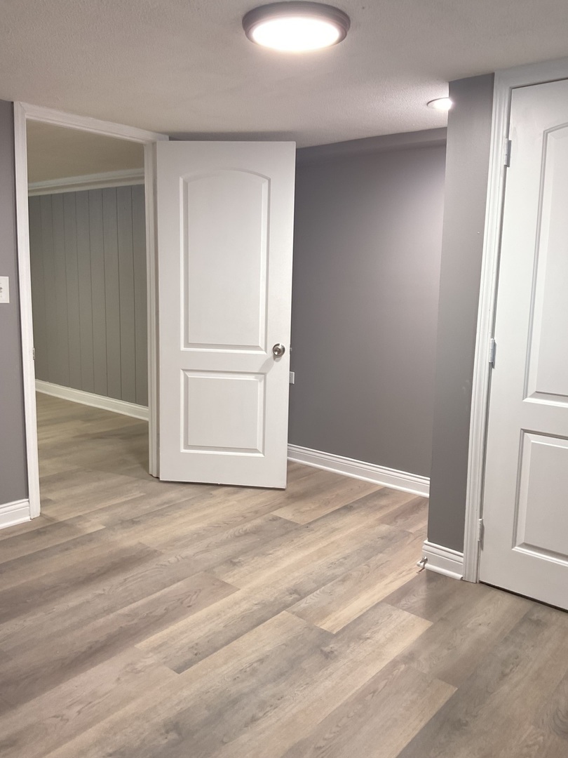 17031 Trapet Avenue Hazel Crest, IL 60429 - Photo 11 of 13 a view of a room with wooden floor