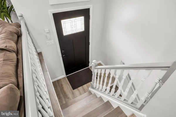 a view of stairs with wooden floor