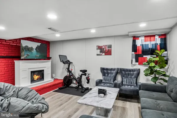 a living room with furniture or couch and a fireplace