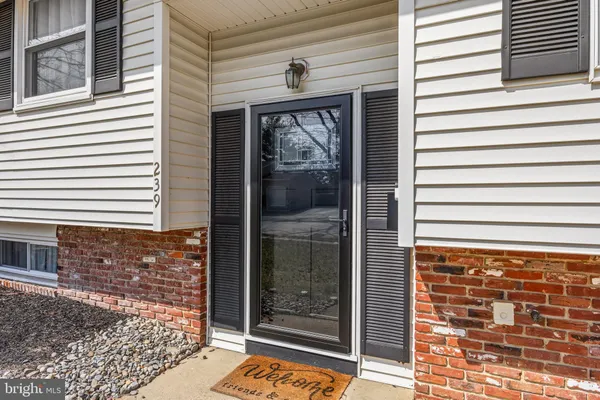a view of a door and a window