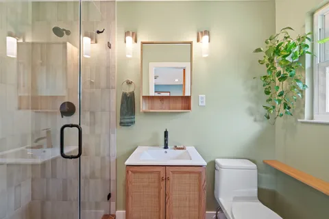 a bathroom with a shower and a sink