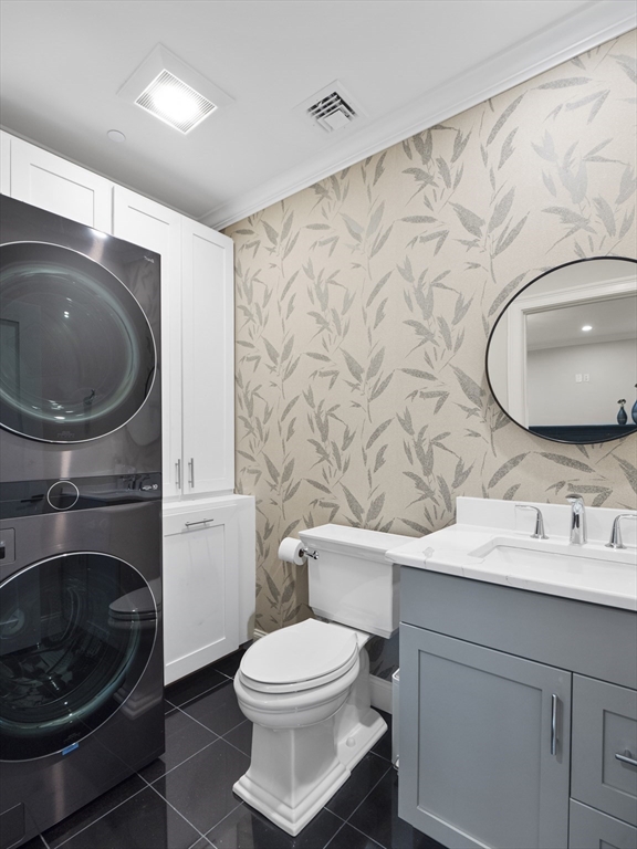 140 Middlesex Street, Unit 3 Lowell, MA 01852 - Photo 12 of 30 a bathroom with a toilet a sink and a mirror