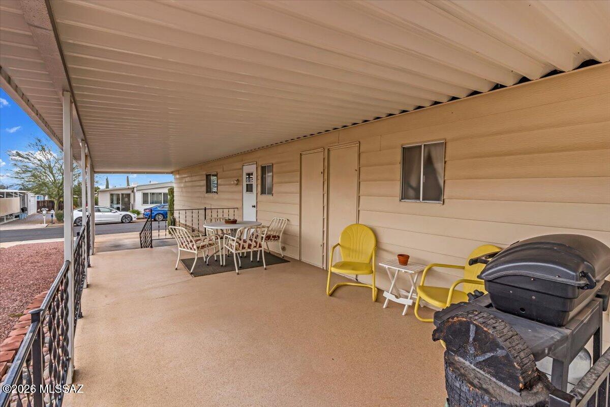 5840 West Flying W Street Tucson, AZ 85713 - Photo 29 of 38 a view of a chairs and tables in patio