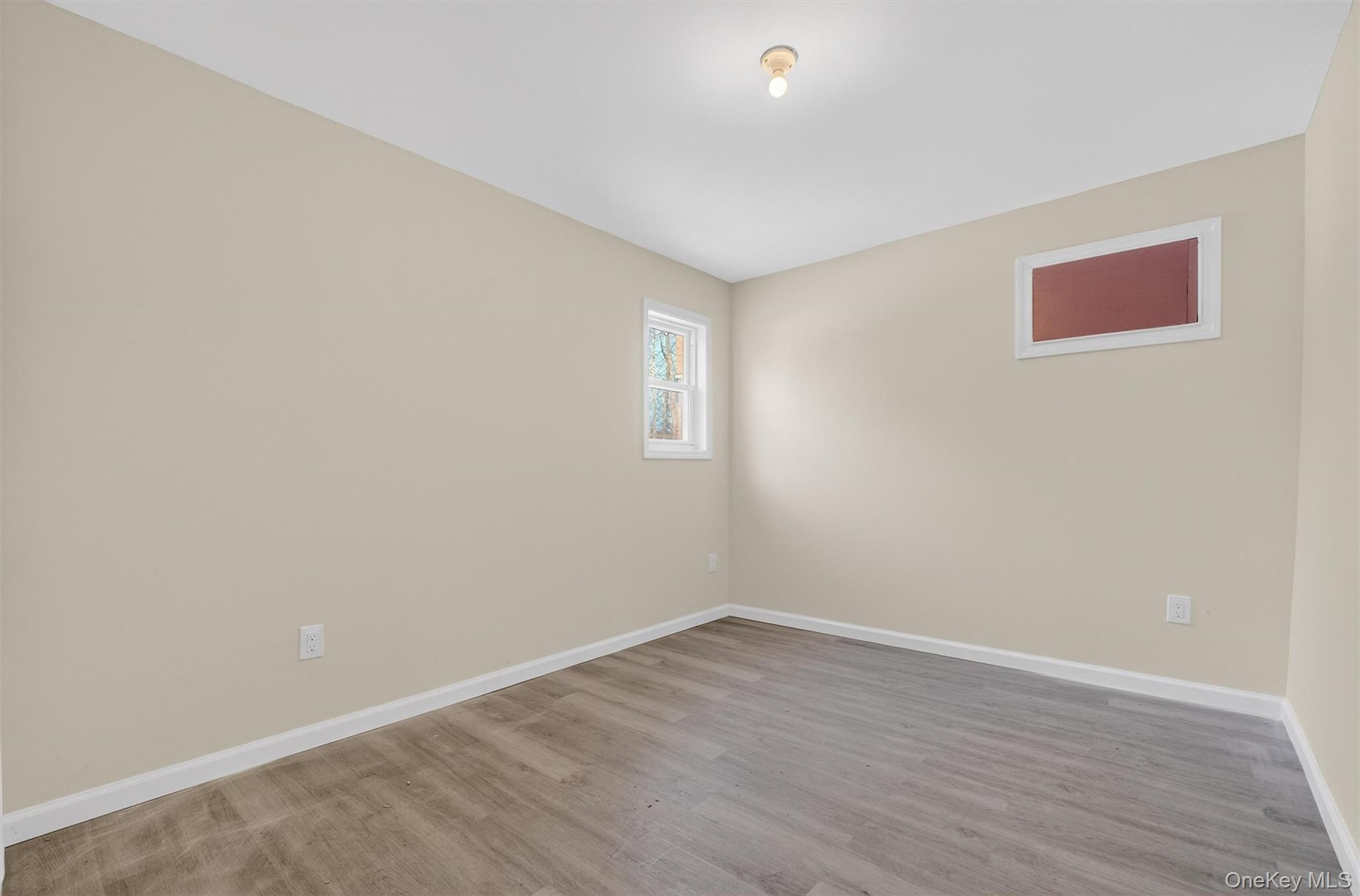 149 Lewis Lane, Unit 1 Wallkill, NY 12589 - Photo 14 of 23 wooden floor in an empty room