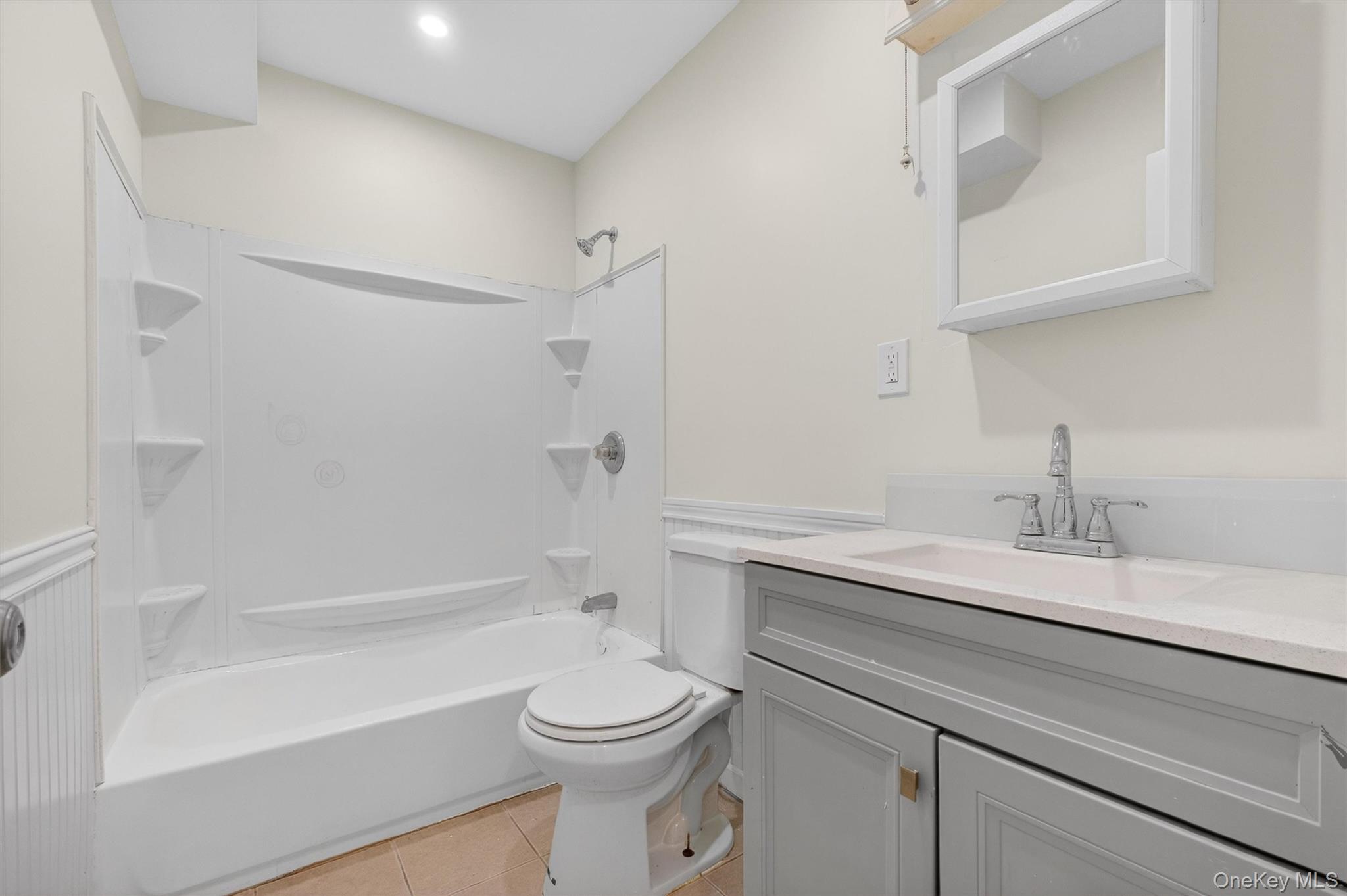 149 Lewis Lane, Unit 1 Wallkill, NY 12589 - Photo 16 of 23 a bathroom with a sink a toilet and a bathtub