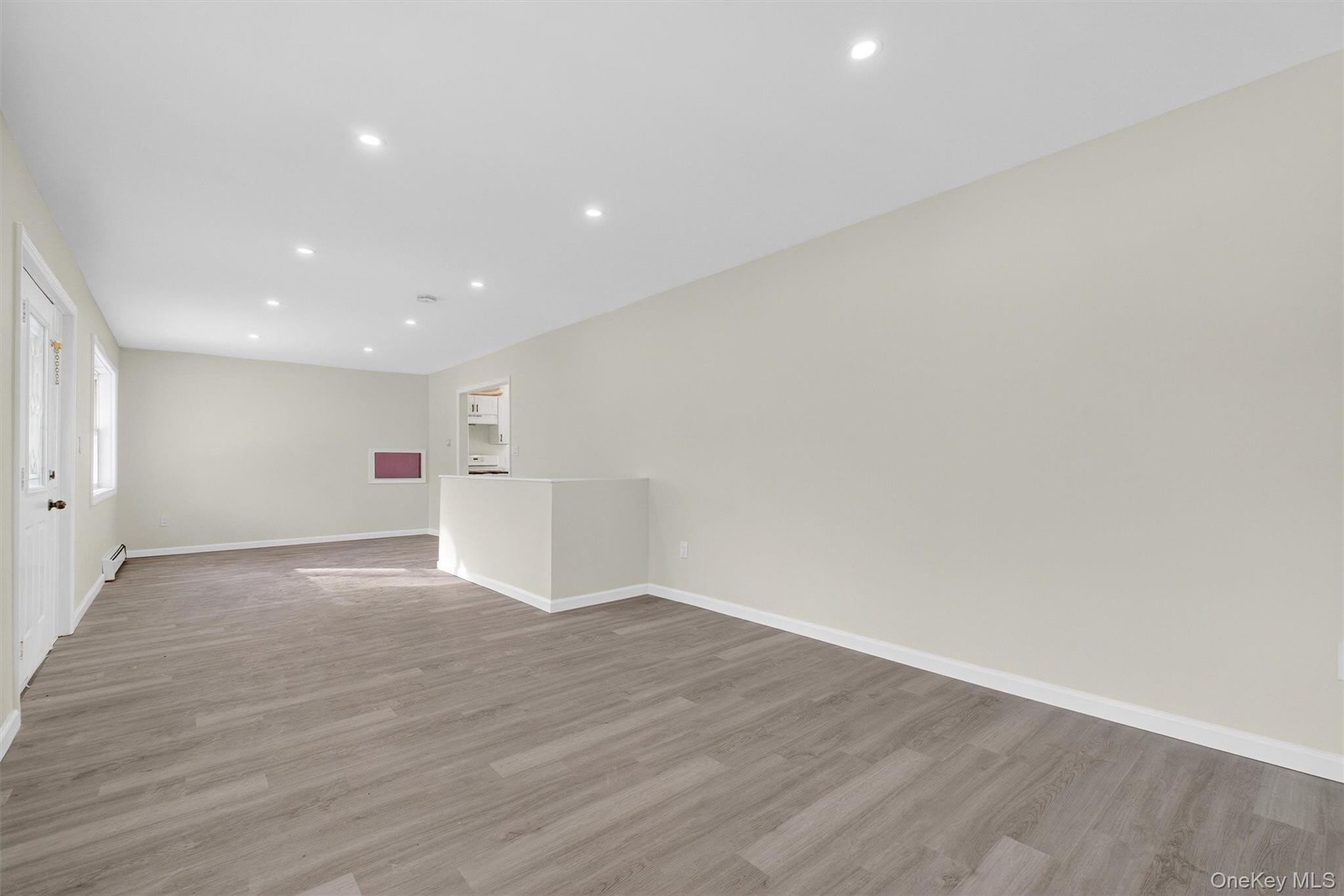 149 Lewis Lane, Unit 1 Wallkill, NY 12589 - Photo 4 of 23 a view of an empty room with wooden floor