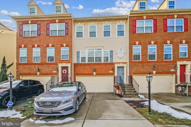 a front view of a house with a yard and outdoor seating