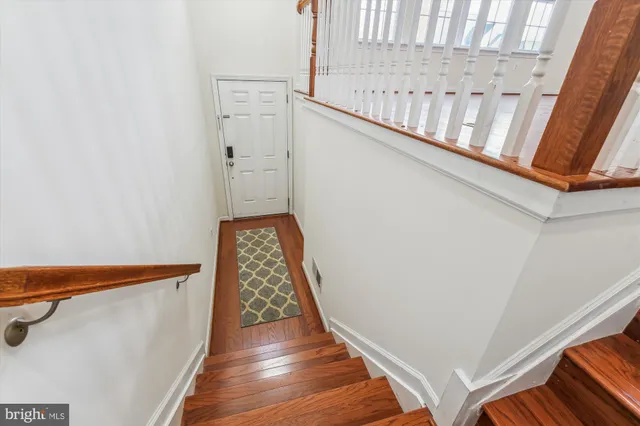 a view of entryway with wooden floor