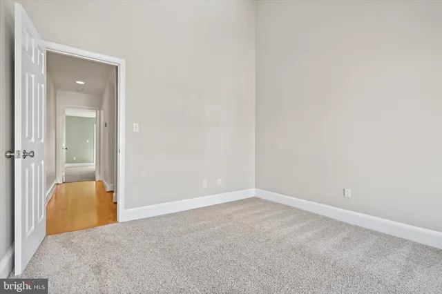 a bathroom with a granite countertop tub sink toilet and shower