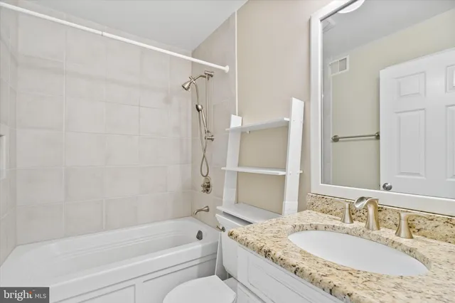 a spacious bedroom with a bed and a window