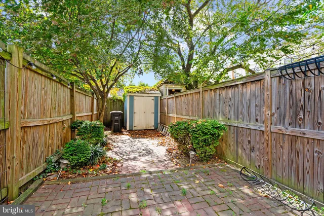 a picture of a room with a white wall and a picture