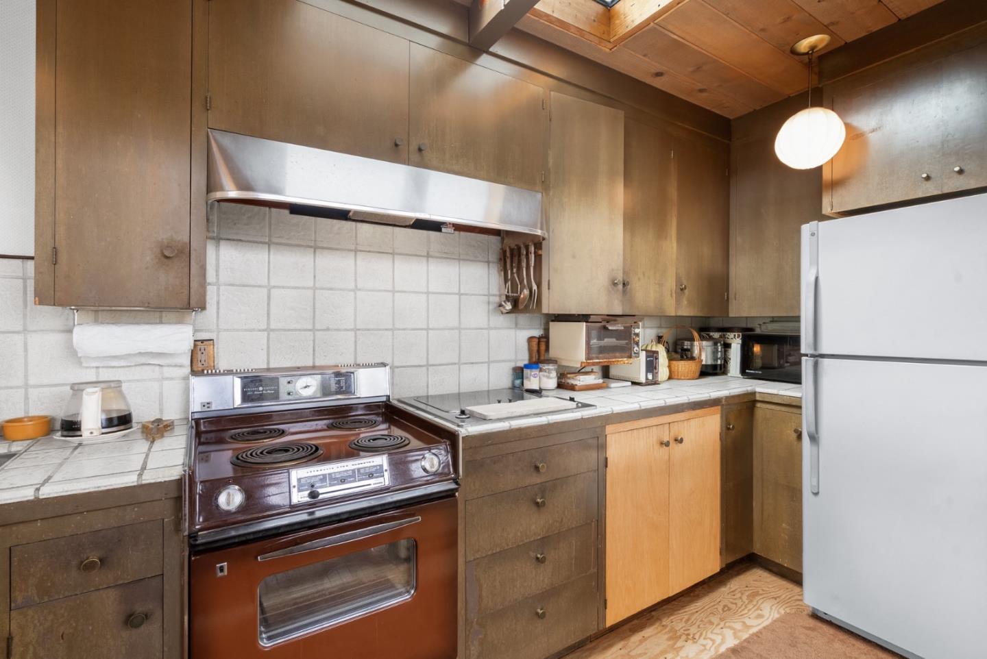 34 Sanderling Circle Watsonville, CA 95076 - Photo 13 of 56 a kitchen with a stove and a refrigerator