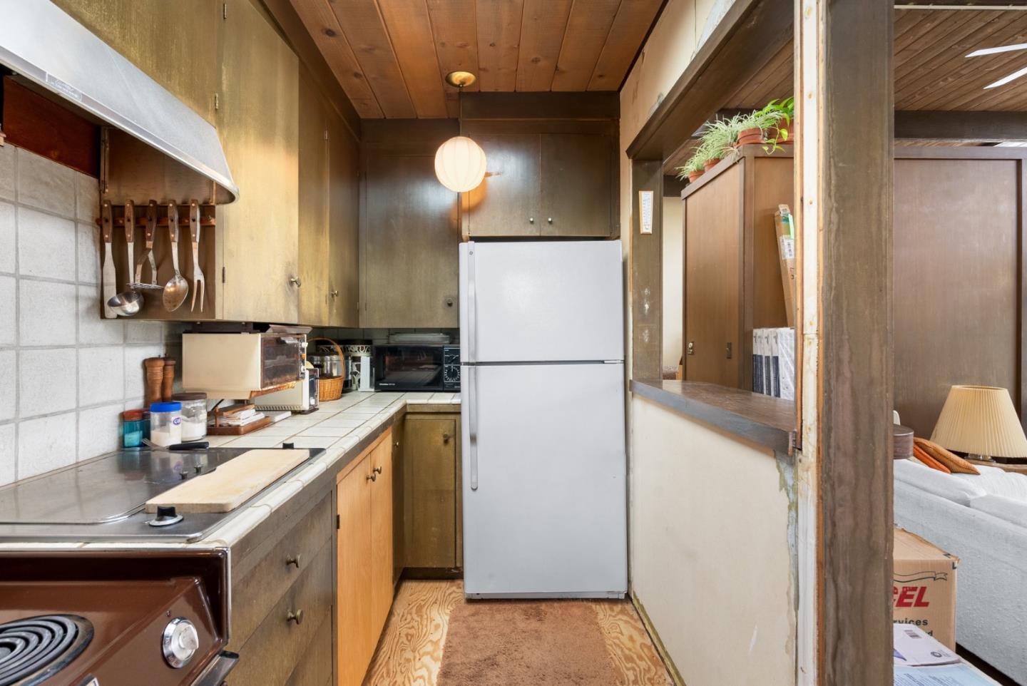 34 Sanderling Circle Watsonville, CA 95076 - Photo 14 of 56 a kitchen with a sink a refrigerator and cabinets