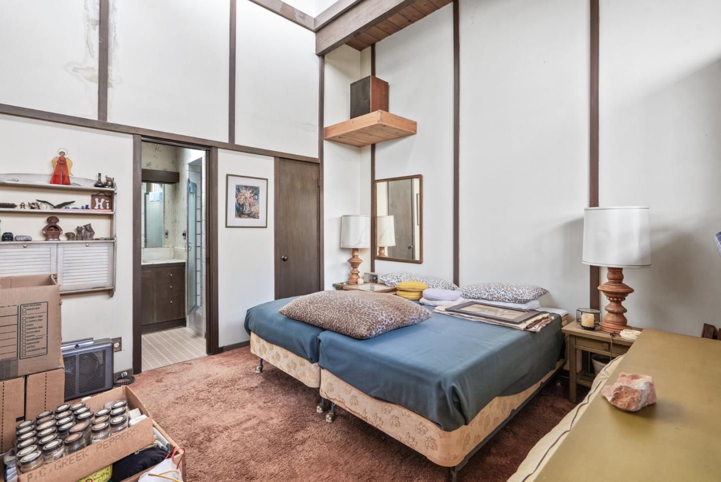 34 Sanderling Circle Watsonville, CA 95076 - Photo 17 of 56 a bedroom with a bed and a chandelier