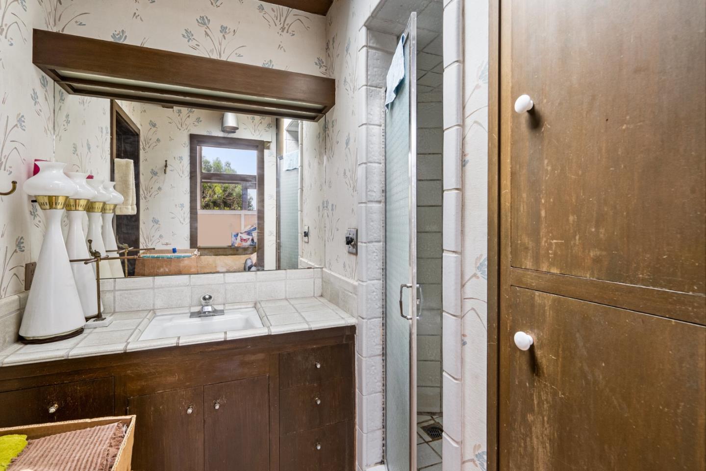 34 Sanderling Circle Watsonville, CA 95076 - Photo 20 of 56 a bathroom with a double vanity sink and mirror