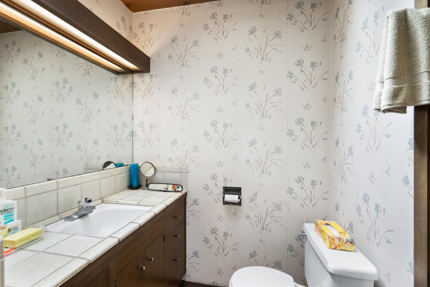 34 Sanderling Circle Watsonville, CA 95076 - Photo 21 of 56 a bathroom with a granite countertop sink and a mirror