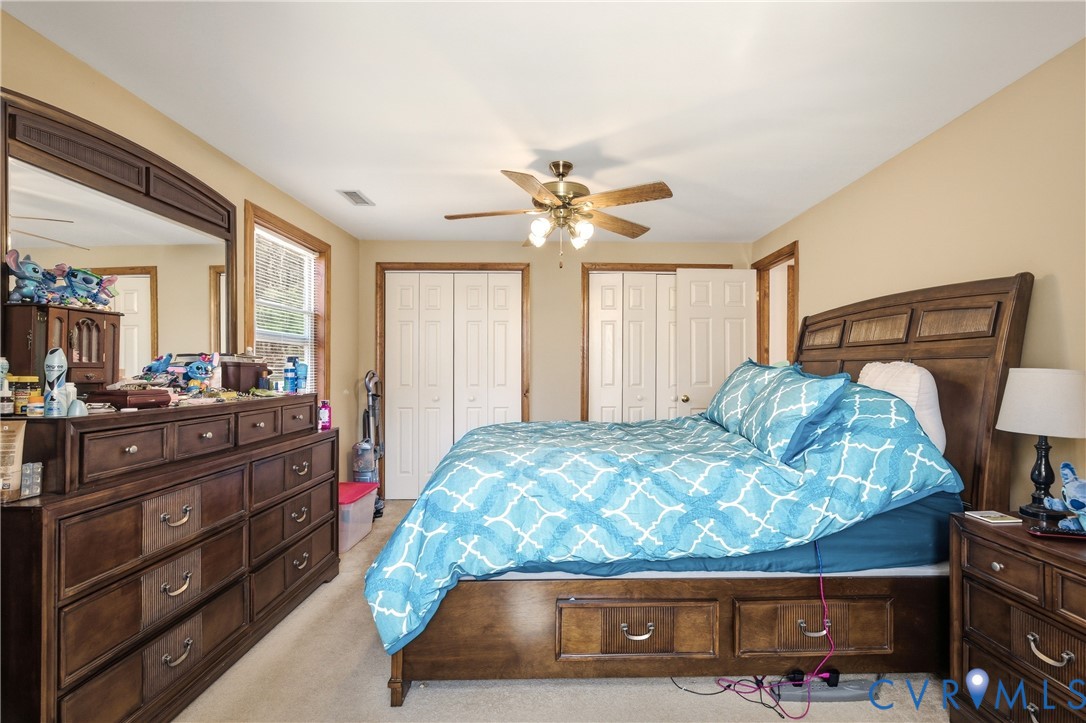 5612 Whitesell Road Louisa, VA 23093 - Photo 14 of 26 a bedroom with a bed and a mirror