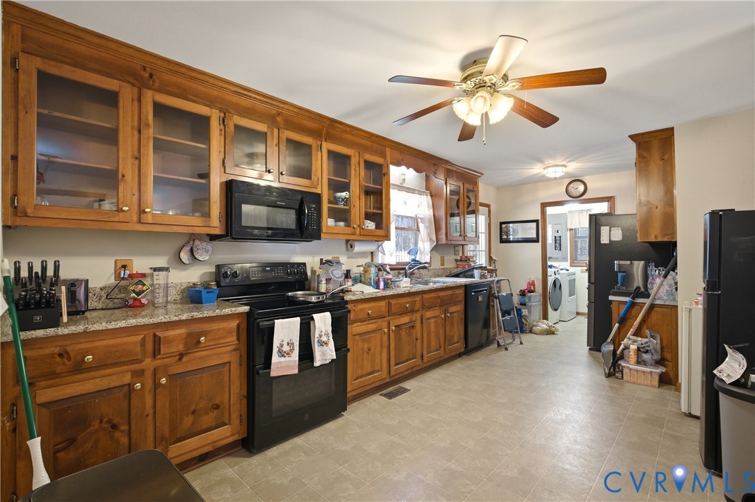 5612 Whitesell Road Louisa, VA 23093 - Photo 16 of 26 a kitchen with stainless steel appliances granite countertop a sink dishwasher stove and refrigerator