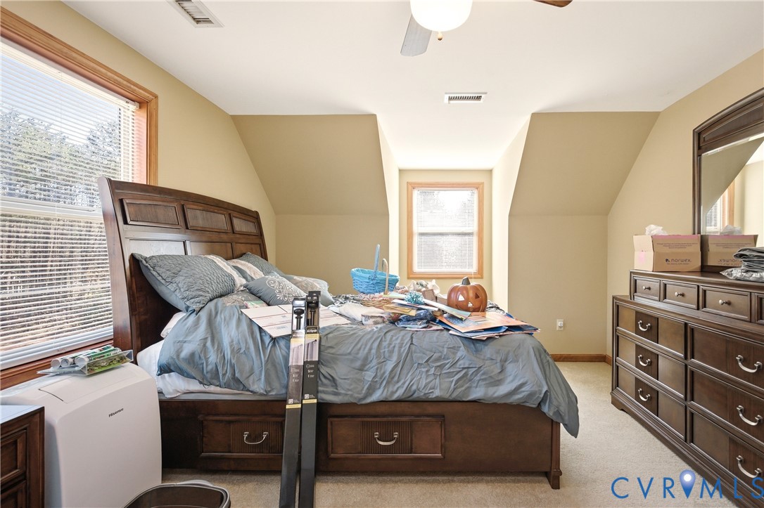 5612 Whitesell Road Louisa, VA 23093 - Photo 17 of 26 a bedroom with a bed and a window