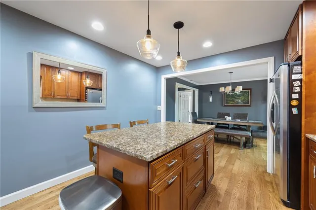 a kitchen that has a table and chairs in it