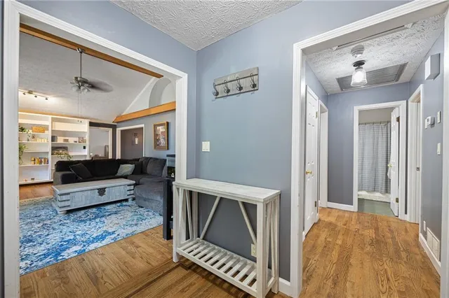a living room with furniture and a rug