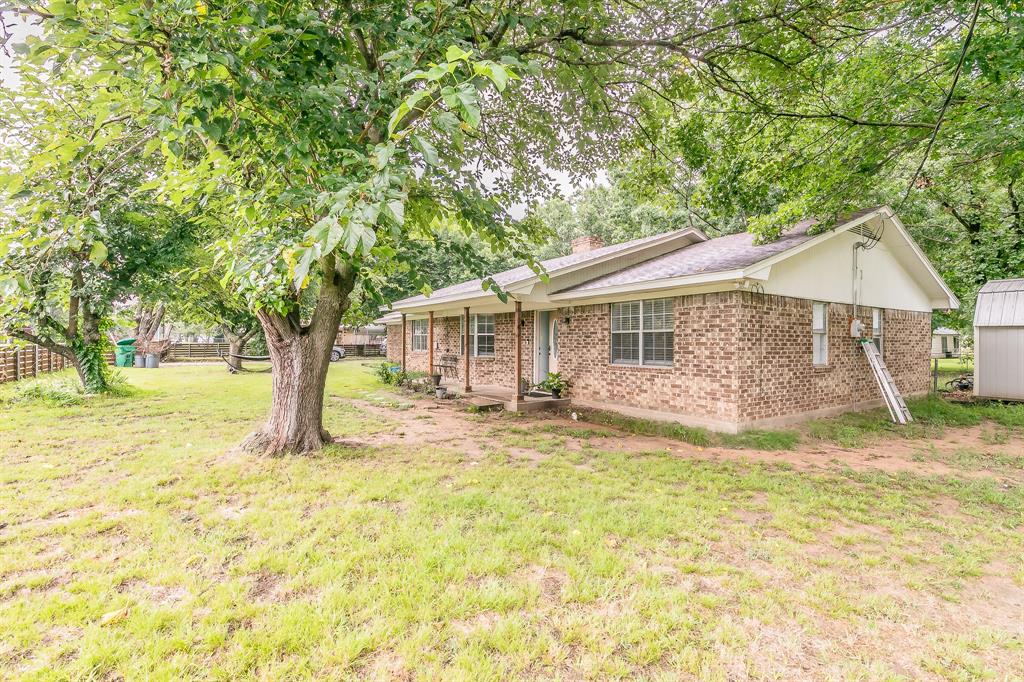 904 Sherman Street Tioga, TX 76271 - Photo 1 of 40 a view of a house with a yard