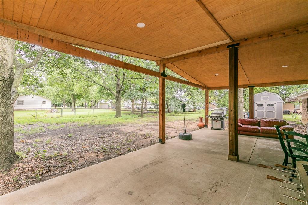 904 Sherman Street Tioga, TX 76271 - Photo 13 of 40 a view of a porch with furniture and garden