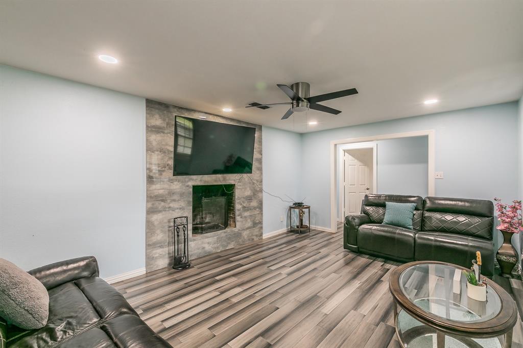 904 Sherman Street Tioga, TX 76271 - Photo 15 of 40 a living room with furniture and a fireplace