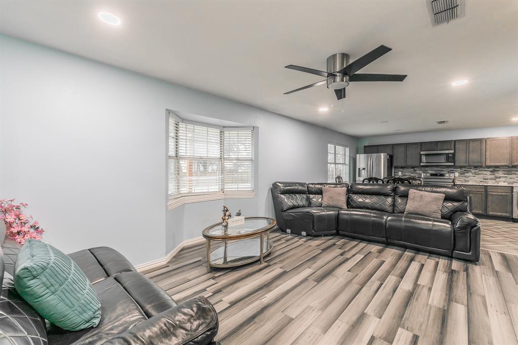 904 Sherman Street Tioga, TX 76271 - Photo 16 of 40 a living room with furniture and a window