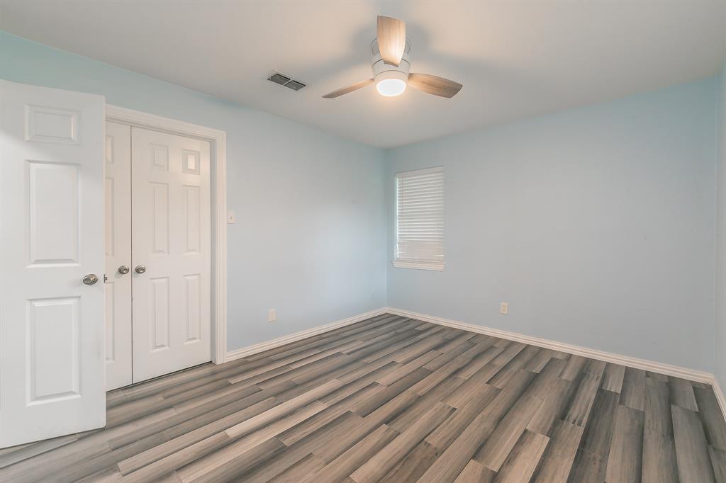 904 Sherman Street Tioga, TX 76271 - Photo 21 of 40 a view of a room with wooden floor