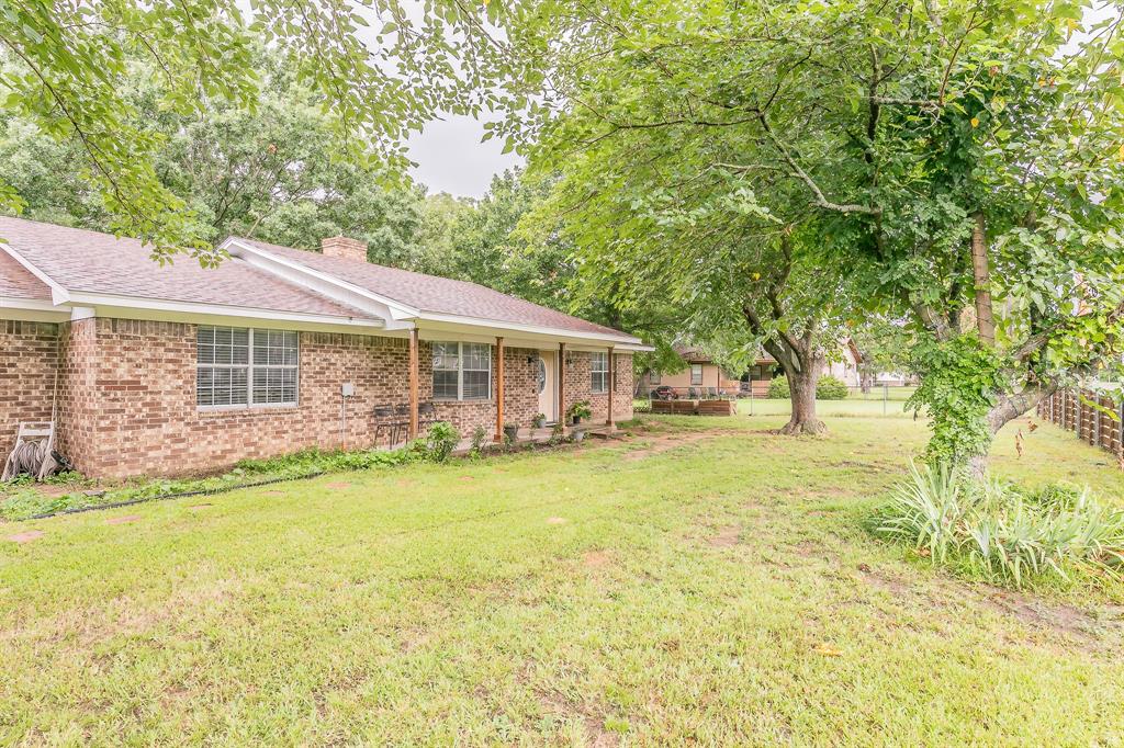 904 Sherman Street Tioga, TX 76271 - Photo 3 of 40 a house with swimming pool in front of it